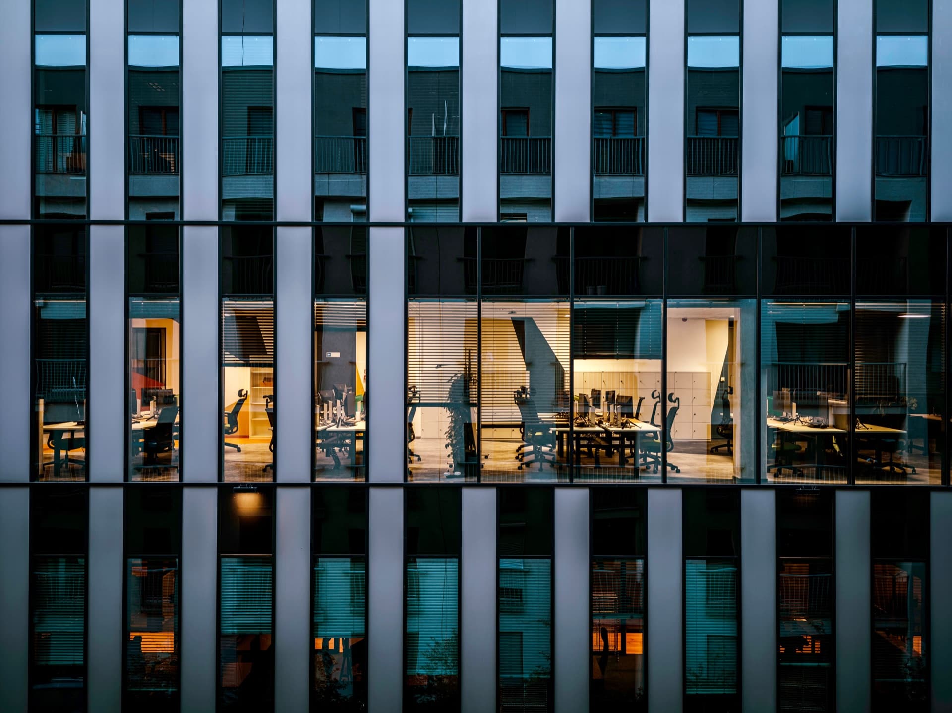 Modern glass office building representing indirect spend categories